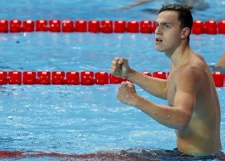 Britain's James Guy celebrates after winning the men's 200m freestyle final at the Aquatics World Championships in Kazan, Russia, August 4, 2015. REUTERS/Michael Dalder