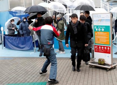 FILE PHOTO: A staff guides participants during an anti-missile evacuation drill at the Tokyo Dome City amusement park in Tokyo, Japan January 22, 2018. REUTERS/Kim Kyung-Hoon