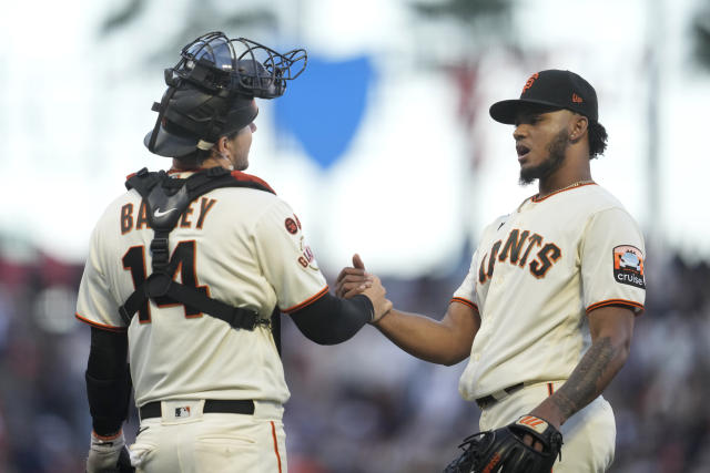 San Francisco Giants Barry Bonds hits one of two home runs in the Giants 8-5