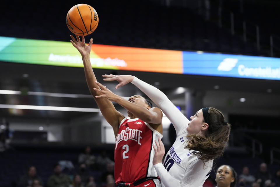 Ohio State forward Taylor Thierry, left, drives against Northwestern forward Caileigh Walsh during the first half of an NCAA college basketball game Wednesday, Dec. 28, 2022, in Evanston, Ill. (AP Photo/Nam Y. Huh)