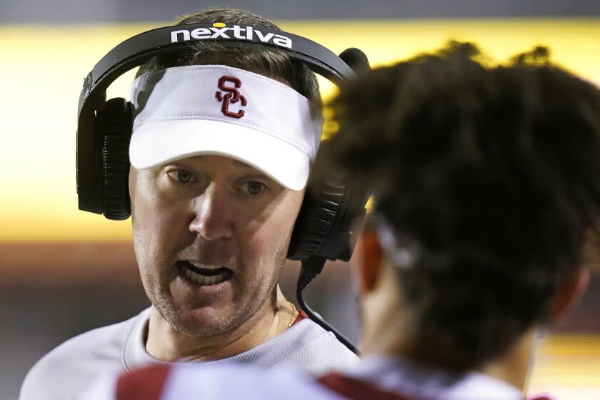 Southern California coach Lincoln Riley speaks with quarterback Caleb Williams.