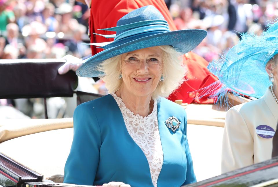 ASCOT, ENGLAND - JUNE 19: Queen Camilla smiles as she attends day two of Royal Ascot 2024 at Ascot Racecourse on June 19, 2024 in Ascot, England. (Photo by Chris Jackson/Getty Images)