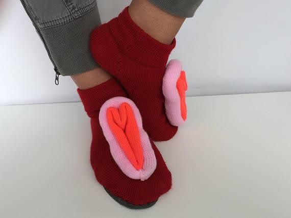 Cute pose, person wearing vagina slippers. Source: Etsy