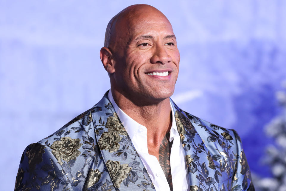 HOLLYWOOD, LOS ANGELES, CALIFORNIA, USA - DECEMBER 09: Actor Dwayne Johnson (The Rock) wearing Dolce & Gabbana arrives at the World Premiere Of Columbia Pictures' 'Jumanji: The Next Level' held at the TCL Chinese Theatre IMAX on December 9, 2019 in Hollywood, Los Angeles, California, United States. (Photo by Xavier Collin/Image Press Agency/Sipa USA)