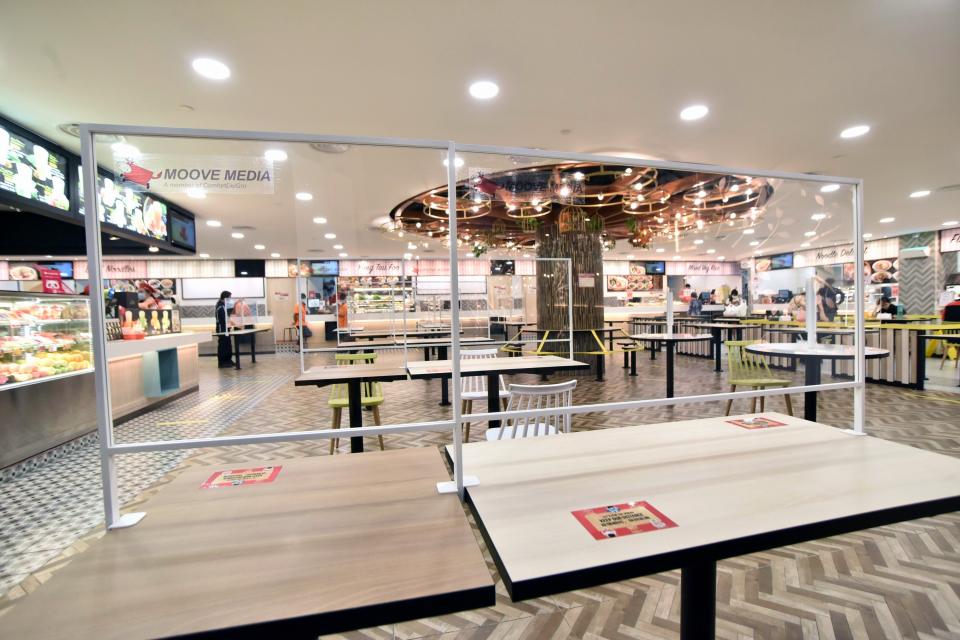 Acrylic shields as table partitions at Koufu foodcourt in Thomson Plaza. (PHOTO: ComfortDelGro)