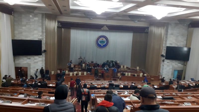 Protesters are seen inside the parliament building, known as the White House, in Bishkek