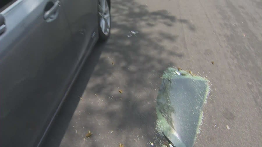 Shattered glass lays next to a vehicle that was broken into in the Playa Del Rey area. Victims spoke with KTLA on April 19, 2024. (KTLA)