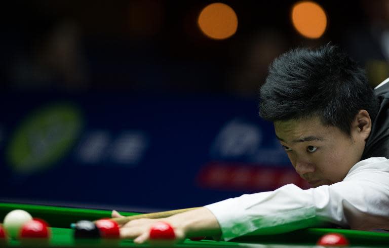 China's Ding Junhui plays a shot during the second round of the Snooker Shanghai Masters in Shanghai on September 11, 2014