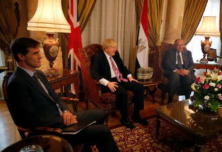 Egyptian foreign minister Sameh Shoukry (R) meets with British Foreign Secretary Boris Johnson (C) at Tahrir Palace in Cairo, Egypt February 25, 2017. REUTERS/Amr Abdallah Dalsh