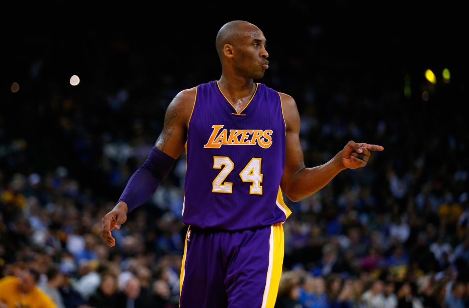 OAKLAND, CA - JANUARY 14:  Kobe Bryant #24 of the Los Angeles Lakers points to a teammate during their game against the Golden State Warriors at ORACLE Arena on January 14, 2016 in Oakland, California. NOTE TO USER: User expressly acknowledges and agrees that, by downloading and or using this photograph, User is consenting to the terms and conditions of the Getty Images License Agreement.  (Photo by Ezra Shaw/Getty Images)