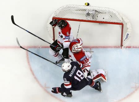 Ice Hockey - 2016 IIHF World Championship - Semi-final - Canada v USA - Moscow, Russia - 21/5/16 - Patrick Maroon of the U.S. in action with Ryan Ellis and goalkeeper Cam Talbot of Canada. REUTERS/Grigory Dukor Picture Supplied by Action Images