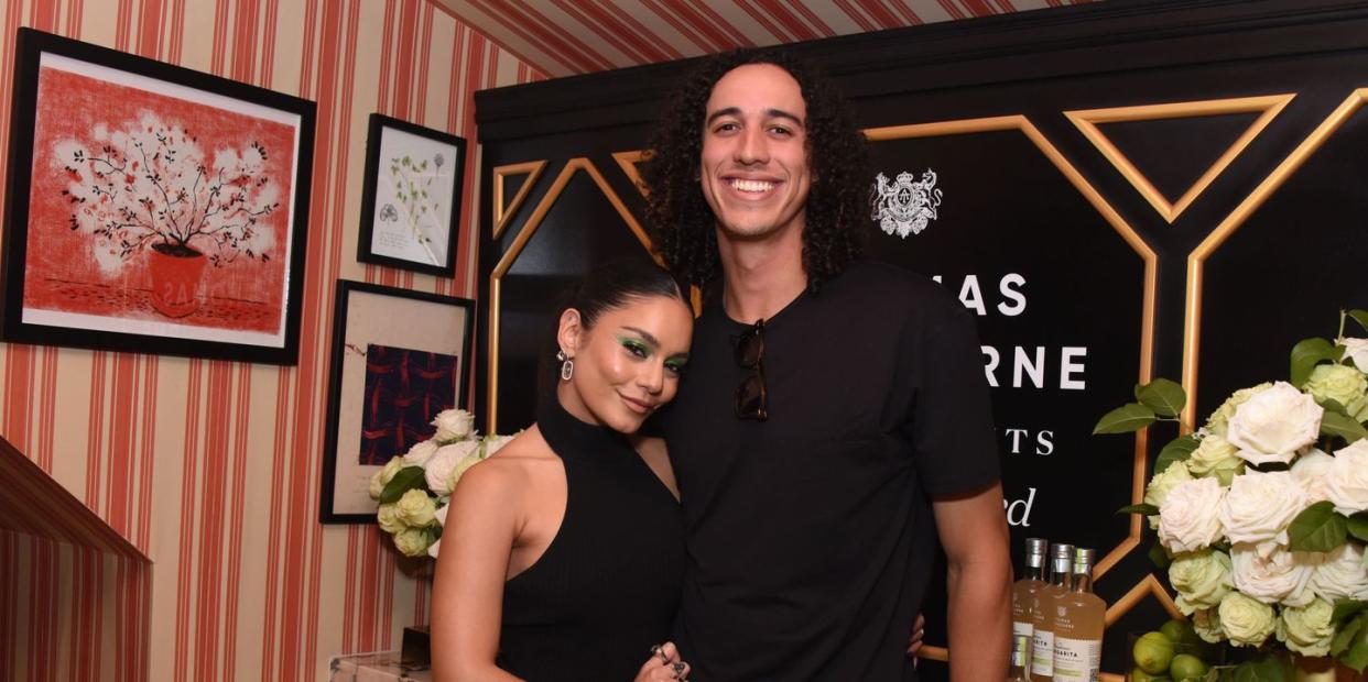 vanessa hudgens and cole tucker in late 2022, both wearing black and smiling for the camera
