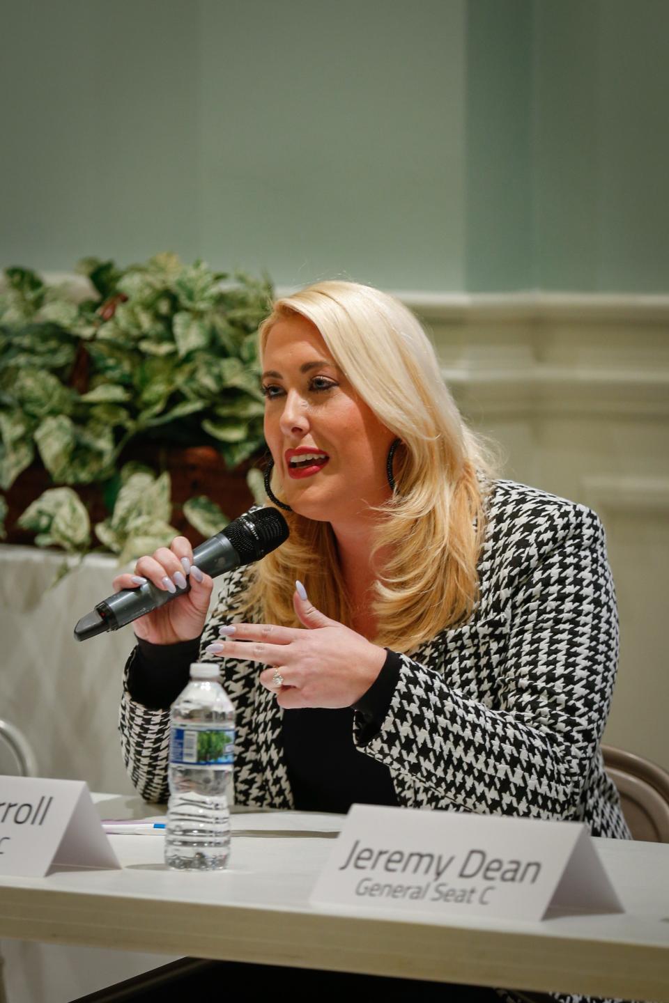 General Seat C candidate Callie Carroll answers a question during the Neighborhood Advisory Council's City Council candidate forum at National Avenue Christian Church on Tuesday, March 7, 2023.