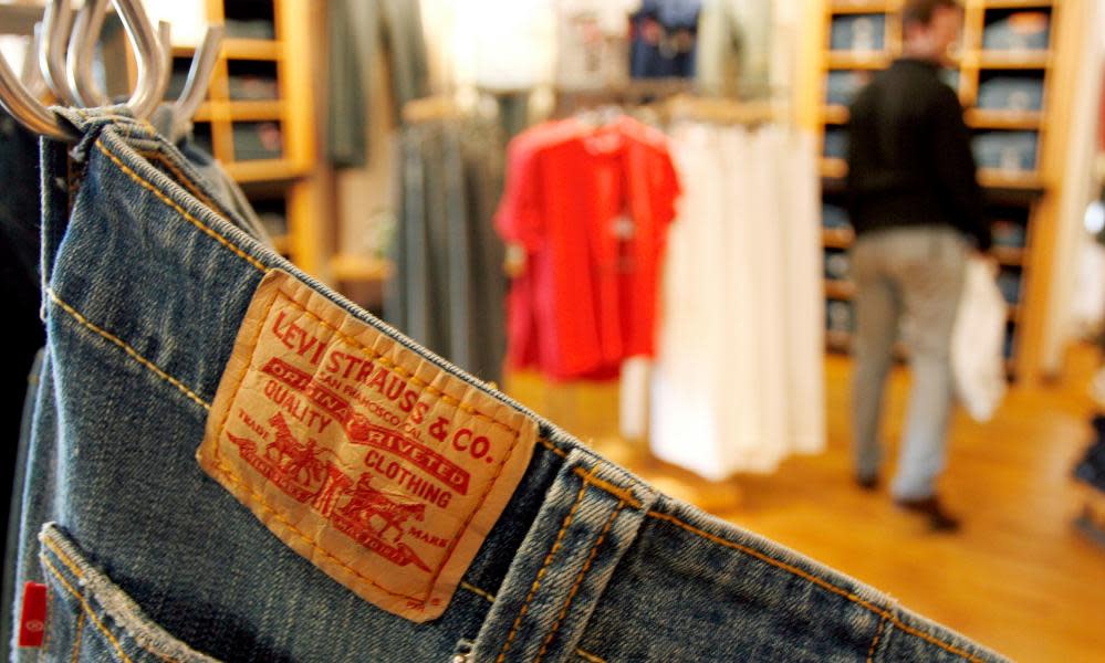 a pair of Levi jeans hangs in a shop