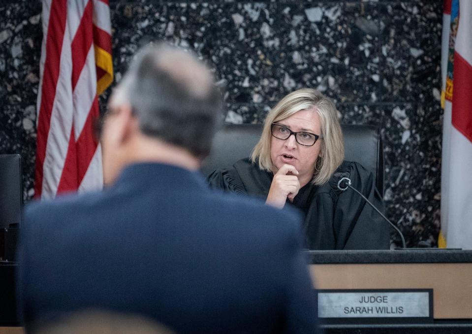 Circuit Judge Sarah Willis talks to attorneys during a pre-trial release hearing in West Palm Beach, Florida on May 13, 2024. Willis granted bail for a couple accused of livestreaming two young boys' sexual abuse.
(Credit: GREG LOVETT/THE PALM BEACH POST)