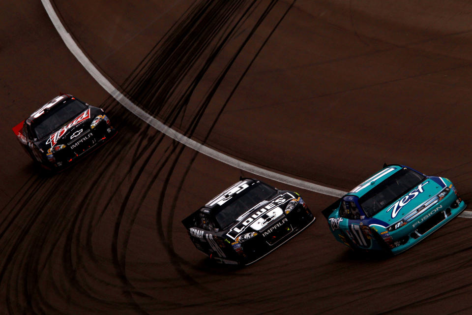 LAS VEGAS, NV - MARCH 11: Matt Kenseth, driver of the #17 Zest Ford, leads Jimmie Johnson, driver of the #48 Lowe's/Kobalt Tools Chevrolet, and Kevin Harvick, driver of the #29 Budweiser Chevrolet, during the NASCAR Sprint Cup Series Kobalt Tools 400 at Las Vegas Motor Speedway on March 11, 2012 in Las Vegas, Nevada. (Photo by Ronald Martinez/Getty Images for NASCAR)