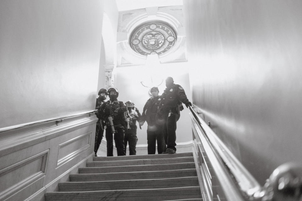 Capitol police seen at the top of a staircase inside the Capitol after a mob of Trump supporters broke in.<span class="copyright">Christopher Lee for TIME</span>