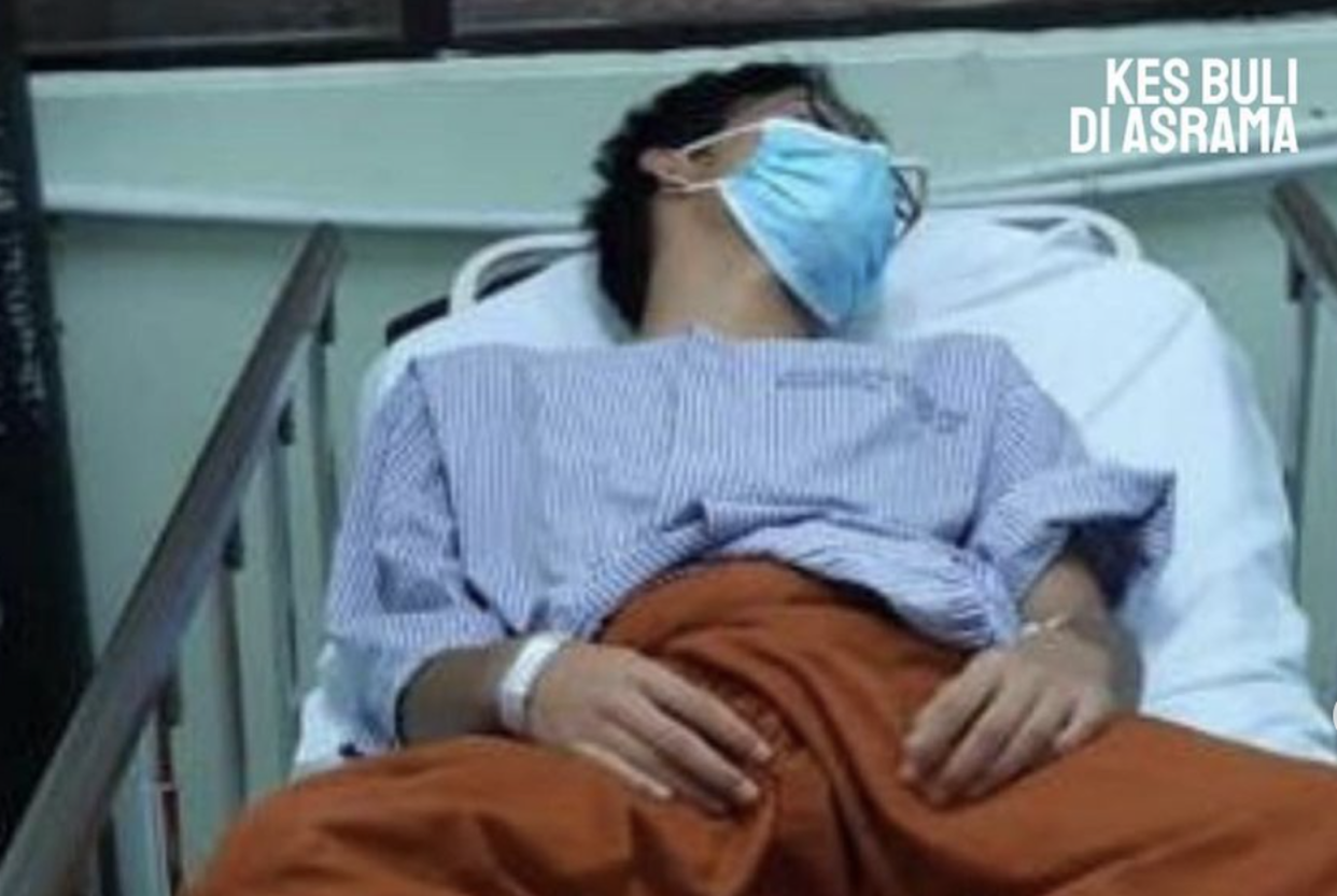 An unconscious student in a hospital bed wearing a hospital gown, illustrating a story on a victim in a bullying case.