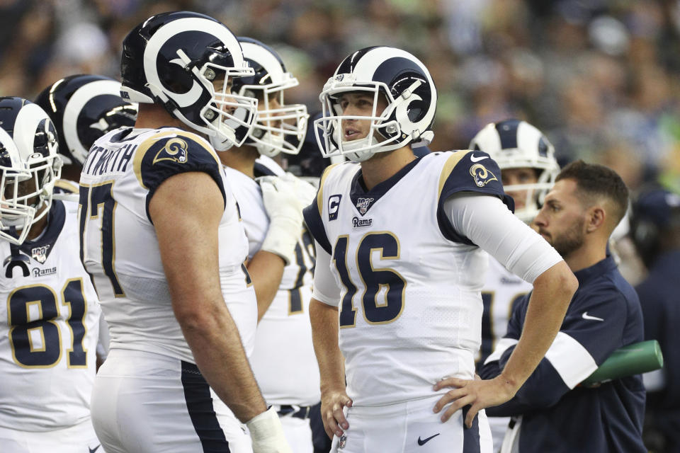 Los Angeles Rams quarterback Jared Goff (16) talks with s offensive tackle Andrew Whitworth (77) during a break during an NFL game against the Seattle Seahawks, Thursday, Oct. 3, 2019, in Seattle. The Seahawks defeated the Rams 30-29. (Margaret Bowles via AP)