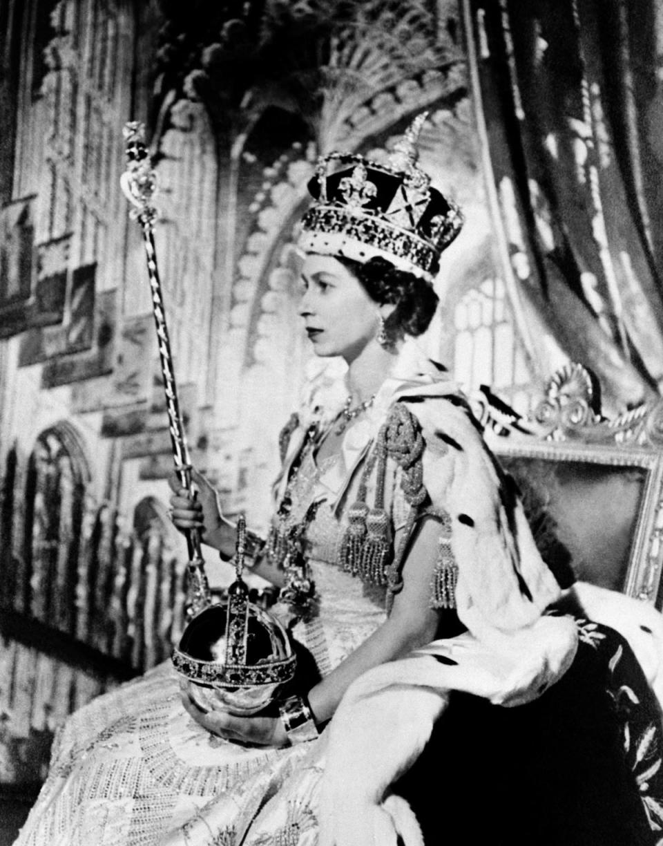 In this file photo taken on 2 June, 1953 the Queen Elizabeth II poses on her Coronation day, in London (AFP via Getty Images)