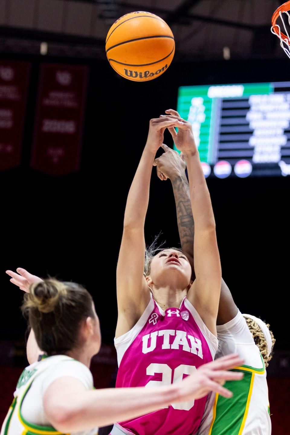 Utah Utes forward Reese Ross (20) jumps to grab the rebound next to Oregon Ducks forward Grace VanSlooten (40) and Oregon Ducks center Phillipina Kyei (15) during a game at the Huntsman Center in Salt Lake City on Saturday, Feb. 11, 2023. | Marielle Scott, Deseret News