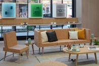 <p>Google Store Chelsea. Interior -- a living room set of cork-colored funiture featuring a Nest Audio speaker on either side of the couch.</p> 