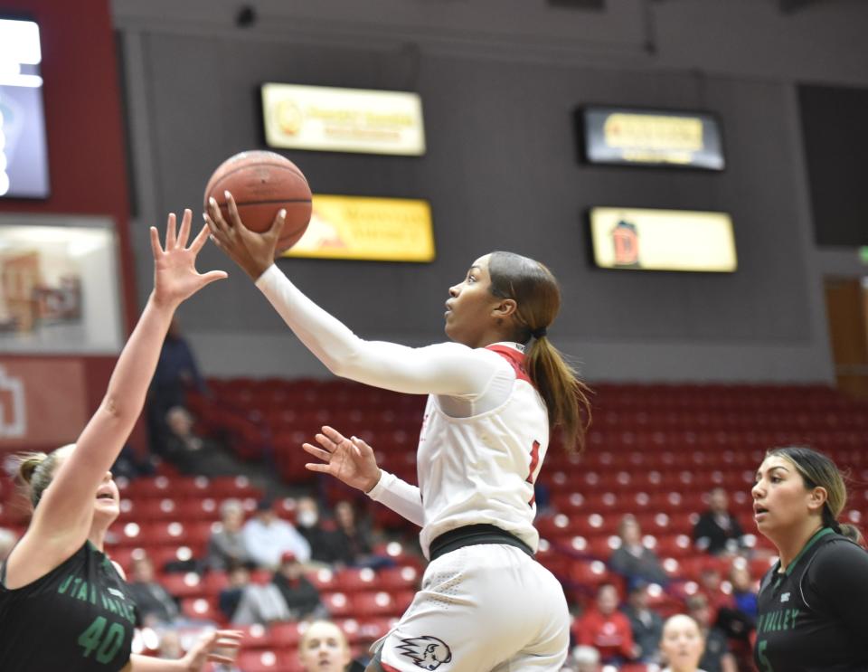 Shanaijah Davison glides in for two of her 12 first quarter points. Davison scored 16 for Dixie in the narrow loss in just her third game of the season.