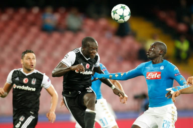 Besiktas' Vincent Aboubakar (C) scores in front of Napoli's Kalidou Koulibaly during their UEFA Champions League Group B match, in Naples, on October 19, 2016