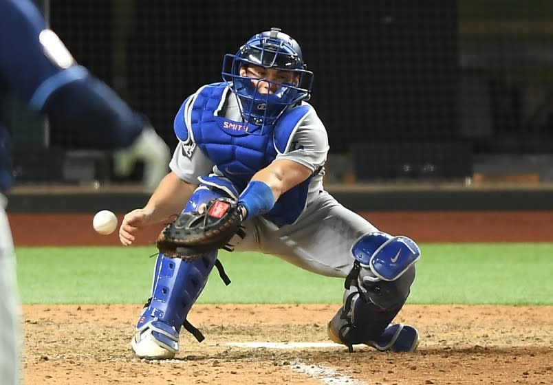 ARLINGTON, TEXAS OCTOBER 24, 2020-Dodgers catcher Will Smith drops the ball allowing the Rays.