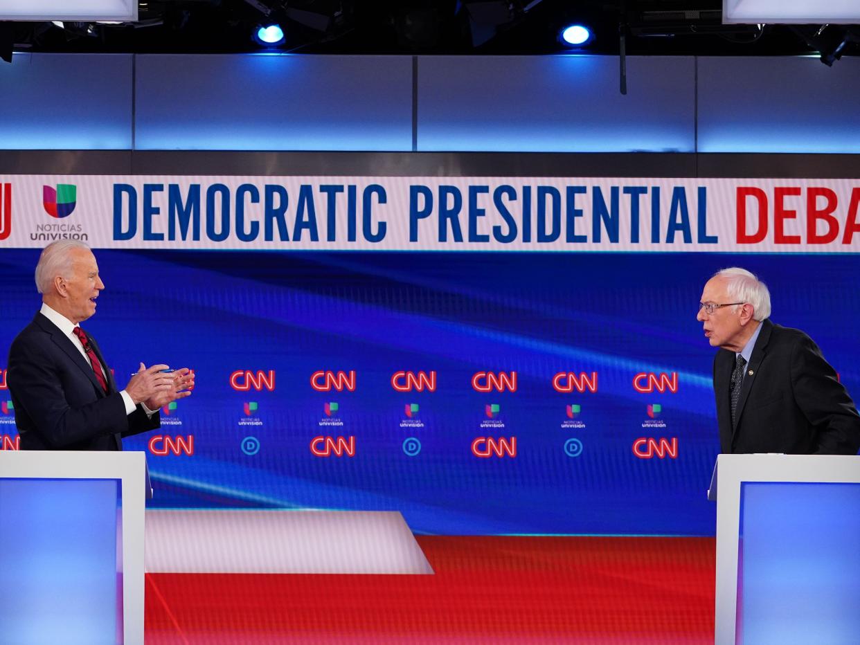 Joe Biden and Bernie Sanders take part in the 11th Democratic Party presidential debate in Washington, DC on March 15, 2020.  (AFP via Getty Images)