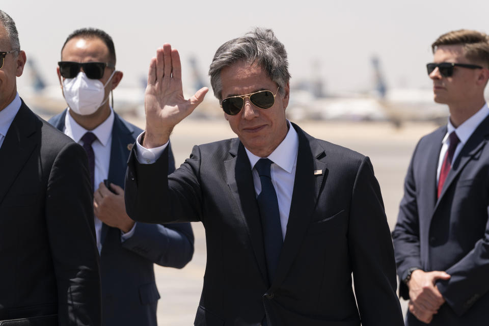 Secretary of State Antony Blinken waves as he steps off his plane upon arrival at Cairo International Airport, Wednesday, May 26, 2021, in Cairo, Egypt. (AP Photo/Alex Brandon, Pool)