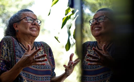 Brazilian Thais de Azevedo, 71, a transgender person who was victim of violence and had her teeth rebuilt by the project "Turma do Bem", poses during an interview with AFP in Sao Paulo, Brazil