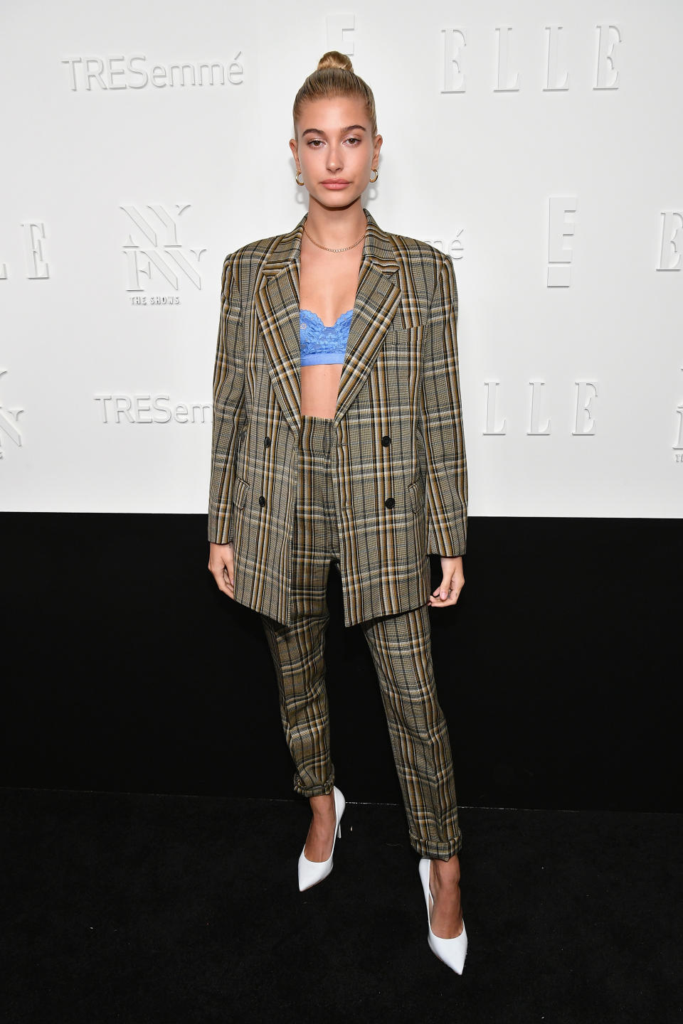 <p>The model rocked a mannish plaid suit by Toga, showing a hint of a lacy blue bra.<br><i>[Photo: Getty]</i> </p>