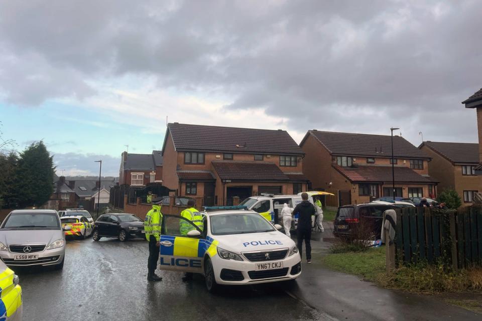 Police officers at the scene at College Court after Mr Marriott died and several others were injured (Dave Higgens/PA) (PA Wire)