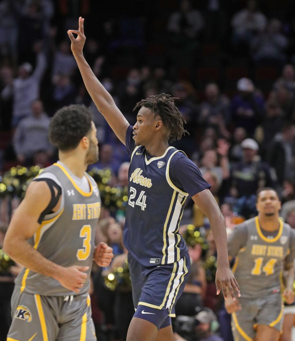 Akron's Ali Ali celebrates a late-game 3-pointer during a Zips win over Kent State in the Mid-American Conference championship game on March 12, 2022, in Cleveland.