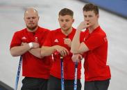 Curling - Pyeongchang 2018 Winter Olympics - Men's Round Robin - Britain v U.S. - Gangneung Curling Center - Gangneung, South Korea - February 21, 2018 - Cameron Smith, Kyle Waddell and Thomas Muirhead of Britain react after losing to the U.S. REUTERS/Phil Noble