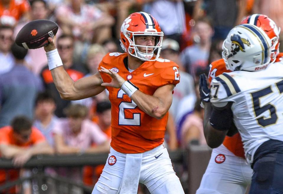 Sep 9, 2023; Clemson, South Carolina, USA; Clemson quarterback Cade Klubnik (2) passes near Charleston Southern defensive line Matt Suriano (57) during the second quarter at Memorial Stadium. Mandatory Credit: Ken Ruinard-USA TODAY Sports