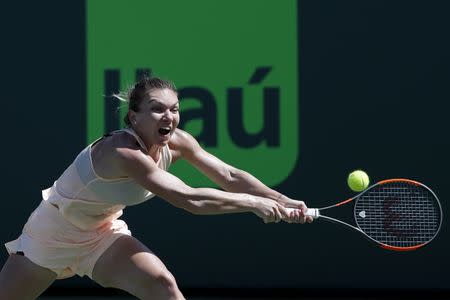 Mar 24, 2018; Key Biscayne, FL, USA; Simona Halep of Romania reaches for a backhand against Agnieszka Radwanska of Poland (not pictured) on day five of the Miami Open at Tennis Center at Crandon Park. Radwanska won 3-6, 6-2, 6-3. Mandatory Credit: Geoff Burke-USA TODAY Sports