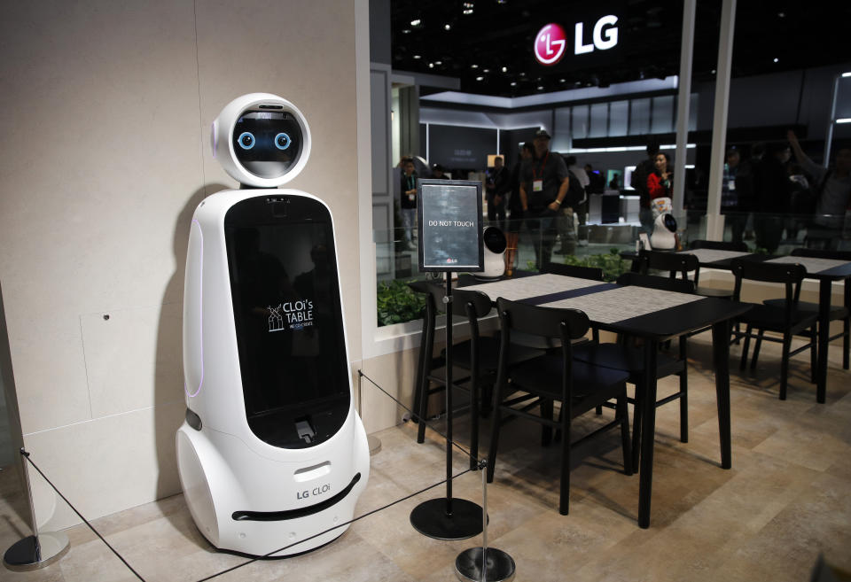 The LG CLOi GuideBot is on display in a mock restaurant setting at the LG booth during the CES tech show, Tuesday, Jan. 7, 2020, in Las Vegas. (AP Photo/John Locher)