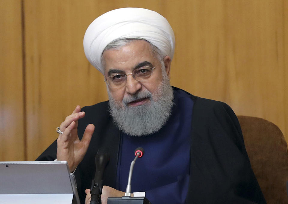 In this photo released by the official website of the office of the Iranian Presidency, President Hassan Rouhani speaks in a cabinet meeting in Tehran, Iran, Wednesday, May 8, 2019. Rouhani said Wednesday that it will begin keeping its excess uranium and heavy water from its nuclear program, setting a 60-day deadline for new terms to its nuclear deal with world powers before it will resume higher uranium enrichment. (Iranian Presidency Office via AP)