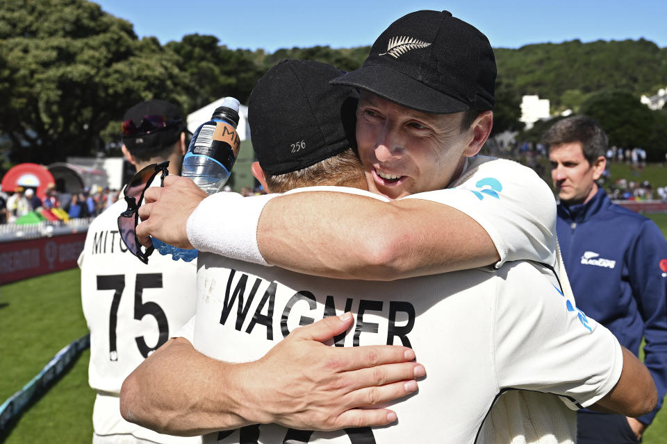 New Zealand's Neil Wagner, left, and teammate Matt Henry embrace after New Zealand won by 1 run on day 5 of their cricket test match against England in Wellington, New Zealand, Tuesday, Feb 28, 2023. (Andrew Cornaga/Photosport via AP)