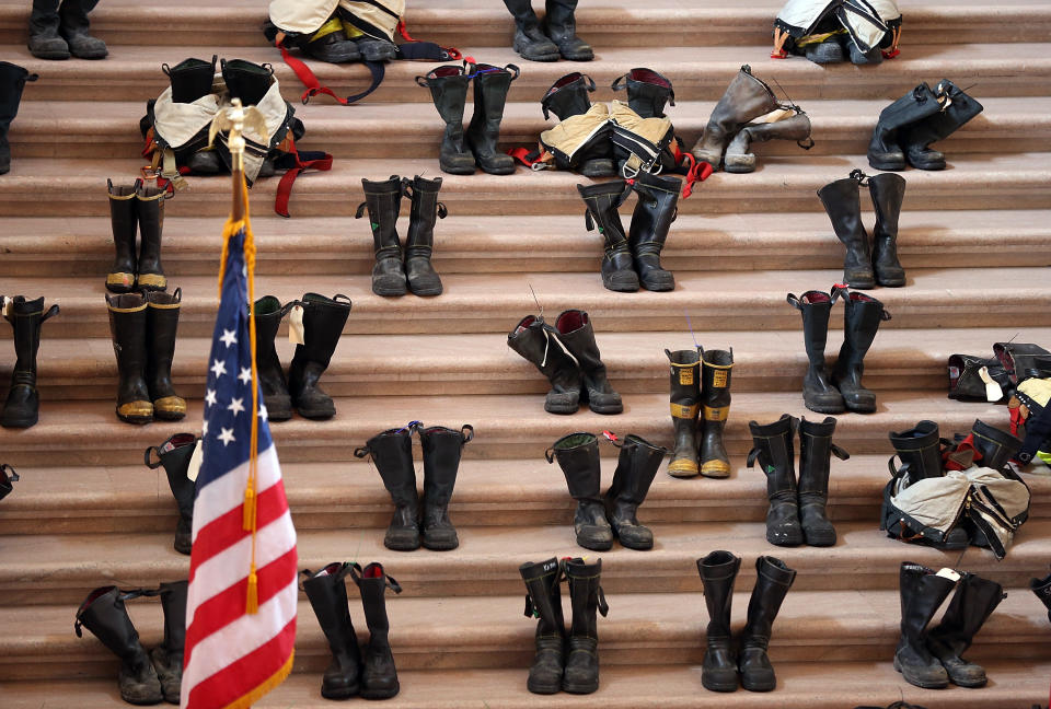 SAN FRANCISCO, CA - MARCH 26:  Firefighter boots line the stairs inside San Francisco City Hall during a remembrance ceremony held for San Francisco firefighters who have died of cancer on March 26, 2014 in San Francisco, California. Over two hundred pairs of boots were displayed on the steps inside San Francisco City Hall to symbolize the 230 San Francisco firefighters who have died of cancer over the past decade. According to a study published by the National Institute for Occupational Safety and Health, (NIOSH)  findings indicate a direct correlation between exposure to carcinogens like flame retardants and higher rate of cancer among firefighters.  The study showed elevated rates of respiratory, digestive and urinary systems cancer and also revealed that participants in the study had high risk of mesothelioma, a cancer associated with asbestos exposure.  (Photo by Justin Sullivan/Getty Images)