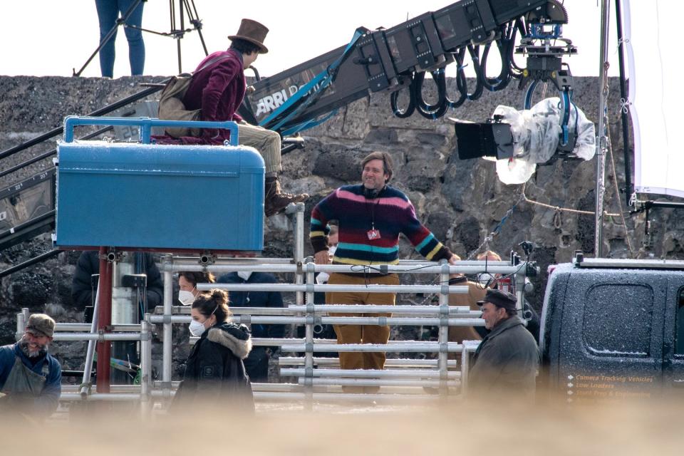 Timothée Chalamet is seen as Willy Wonka with director Paul King during filming for the upcoming movie 'Wonka' on October 12, 2021, in Lyme Regis, England. 