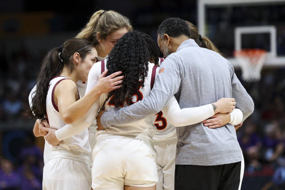 Kenny Brooks, right, stood in a team huddle prior to coaching Virginia Tech against LSU in last season’s Final Four. The Hokies took a nine-point lead into the fourth quarter, but fell to eventual national champion LSU 79-72. Kevin Jairaj/USA TODAY NETWORK