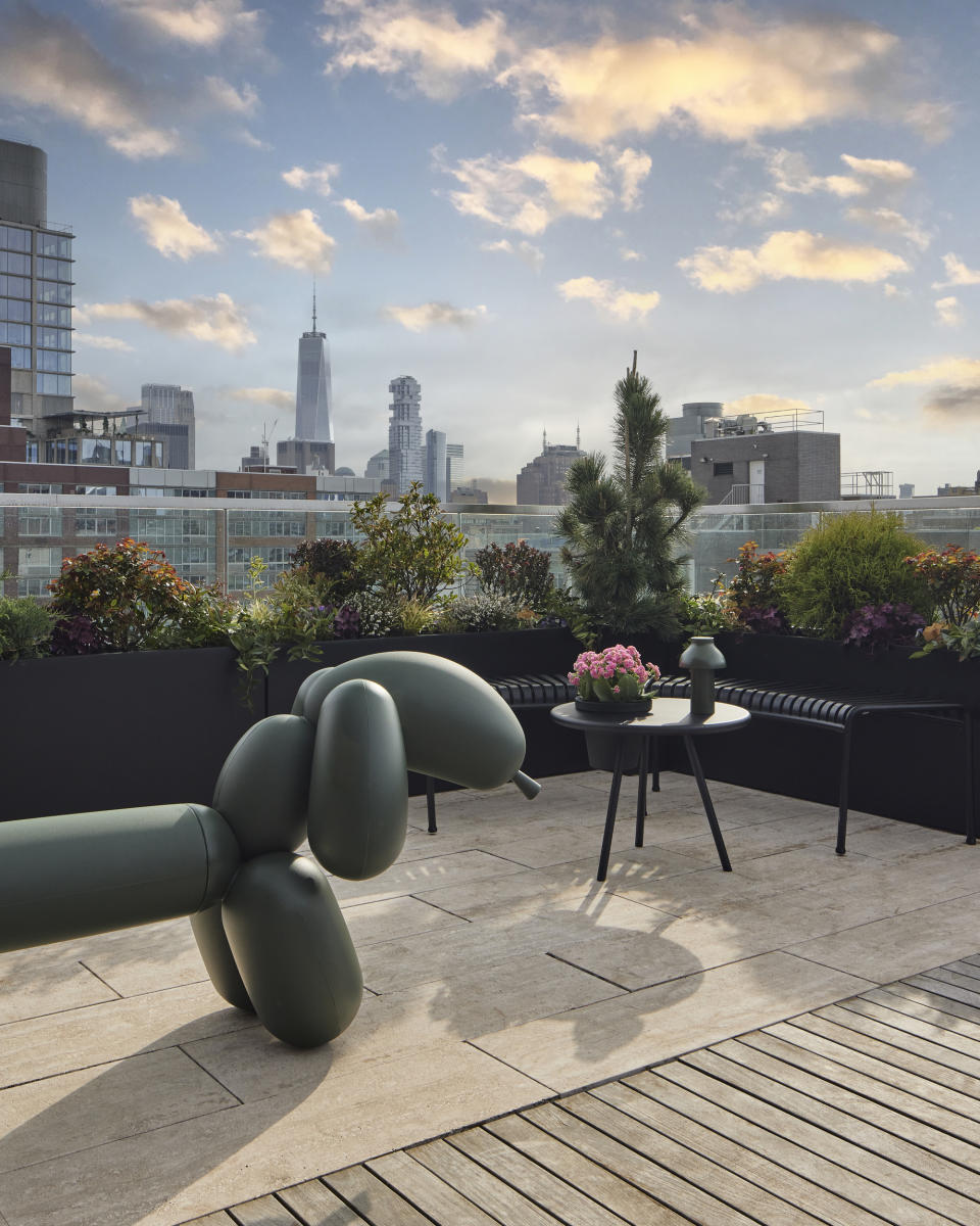 roof terrace with wiener dog artwork that doubles as bench