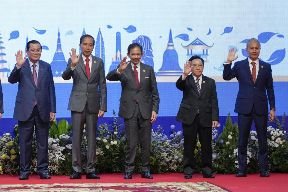 From left to right, Cambodia Prime Minister Hun Sen, Indonesia's President Joko Widodo, Brunei's Sultan Hassanal Bolkiah, Laos Prime Minister Phankham Viphavanh, and Malaysia Speaker of the House of Representatives Azhar Azizan Harun wave during the opening ceremony of the 40th and 41st ASEAN Summits (Association of Southeast Asian Nations) in Phnom Penh, Cambodia, Friday, Nov. 11, 2022. (AP Photo/Vincent Thian)