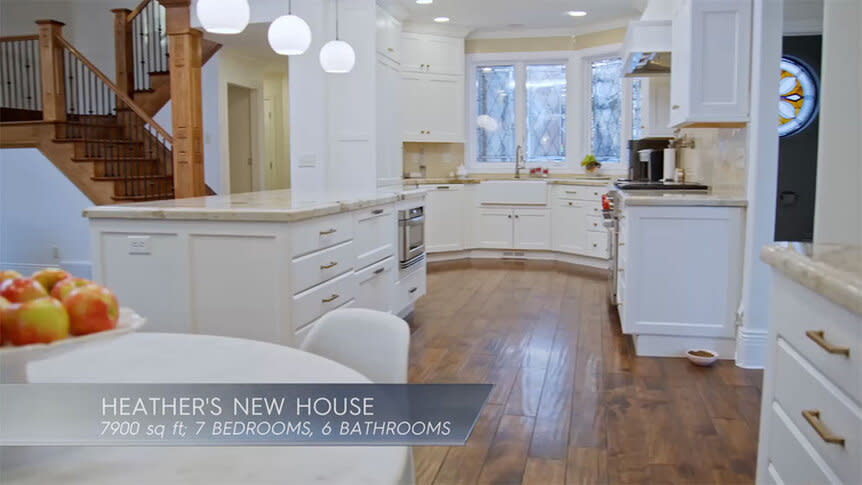 Heather Gay's all-white kitchen with wood flooring and with text overlaid, 