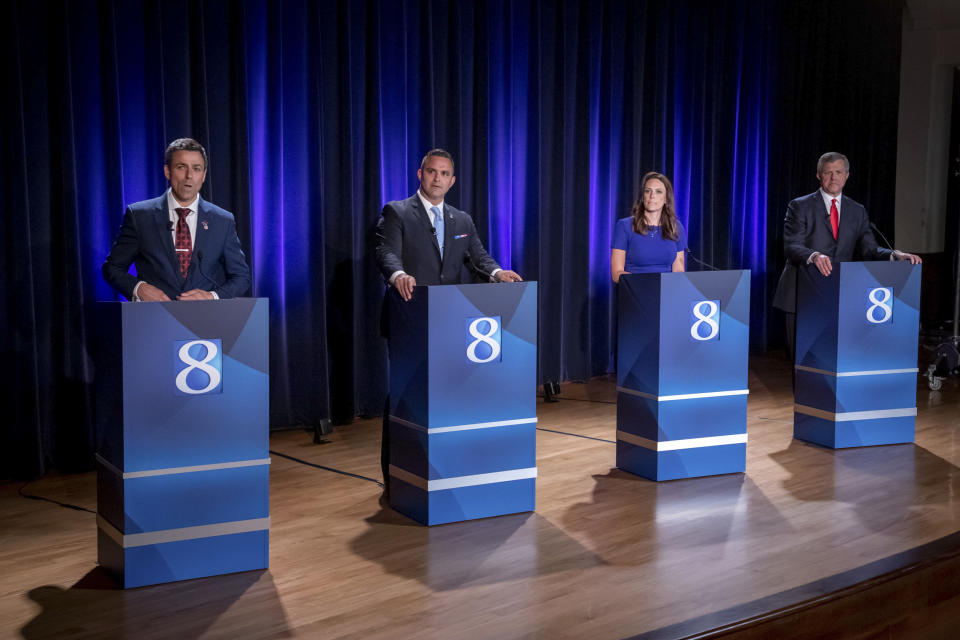 From left, Michigan Republican candidates for governor Ryan Kelley, Garrett Soldano, Tudor Dixon and Kevin Rinke at a debate on July 6. (Michael Buck / WOOD TV8 via AP file)