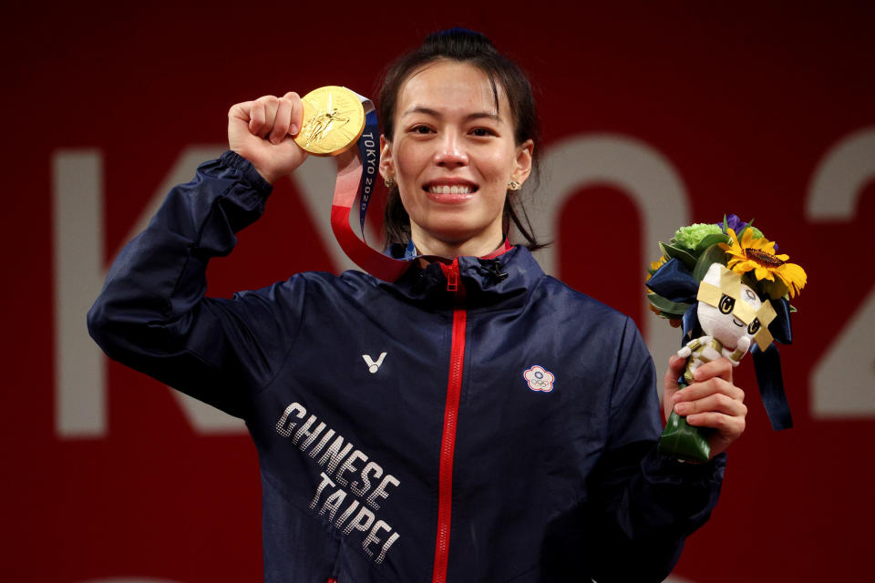 Hsing-Chun Kuo of Team Chinese Taipei poses with the gold medal