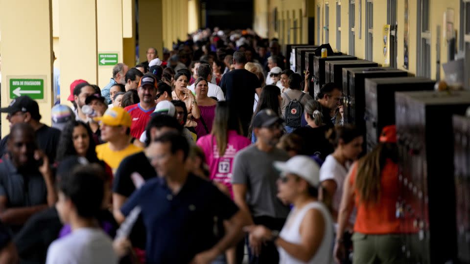 Voters walk inside a polling station during a general election in Panama City, Sunday, May 5, 2024 - Matias Delacroix/AP